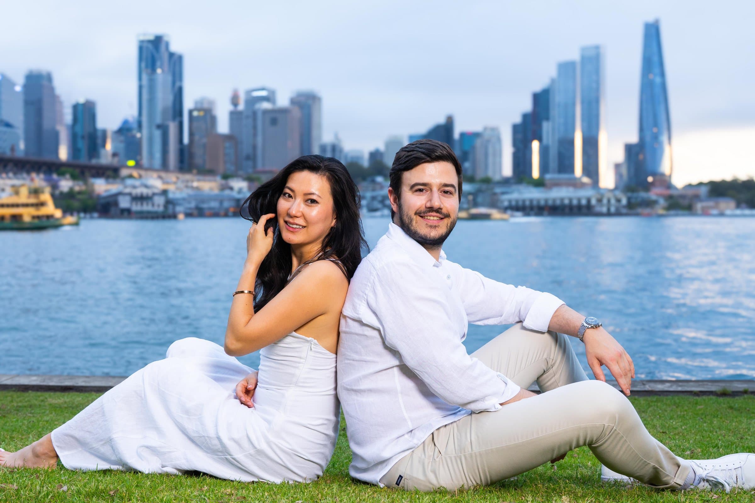 Couple portrait with a city skyline photographed by Bluebird Lens