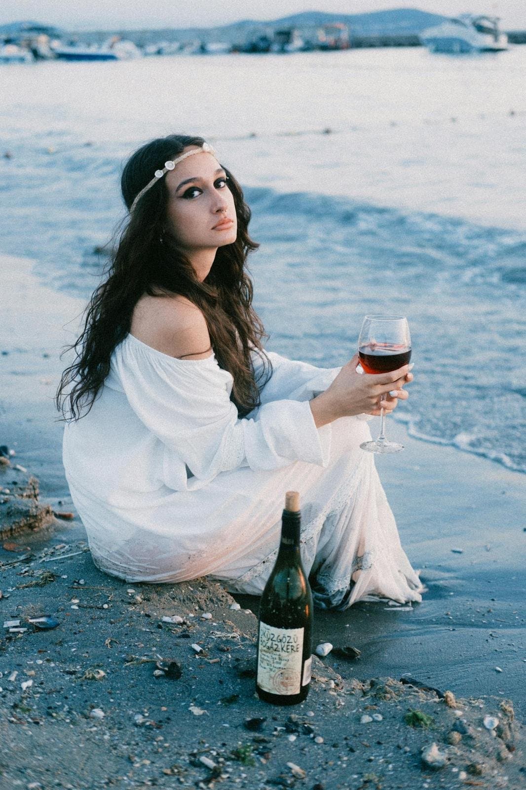Art-directed beach portrait in a white dress by Bluebird Lens