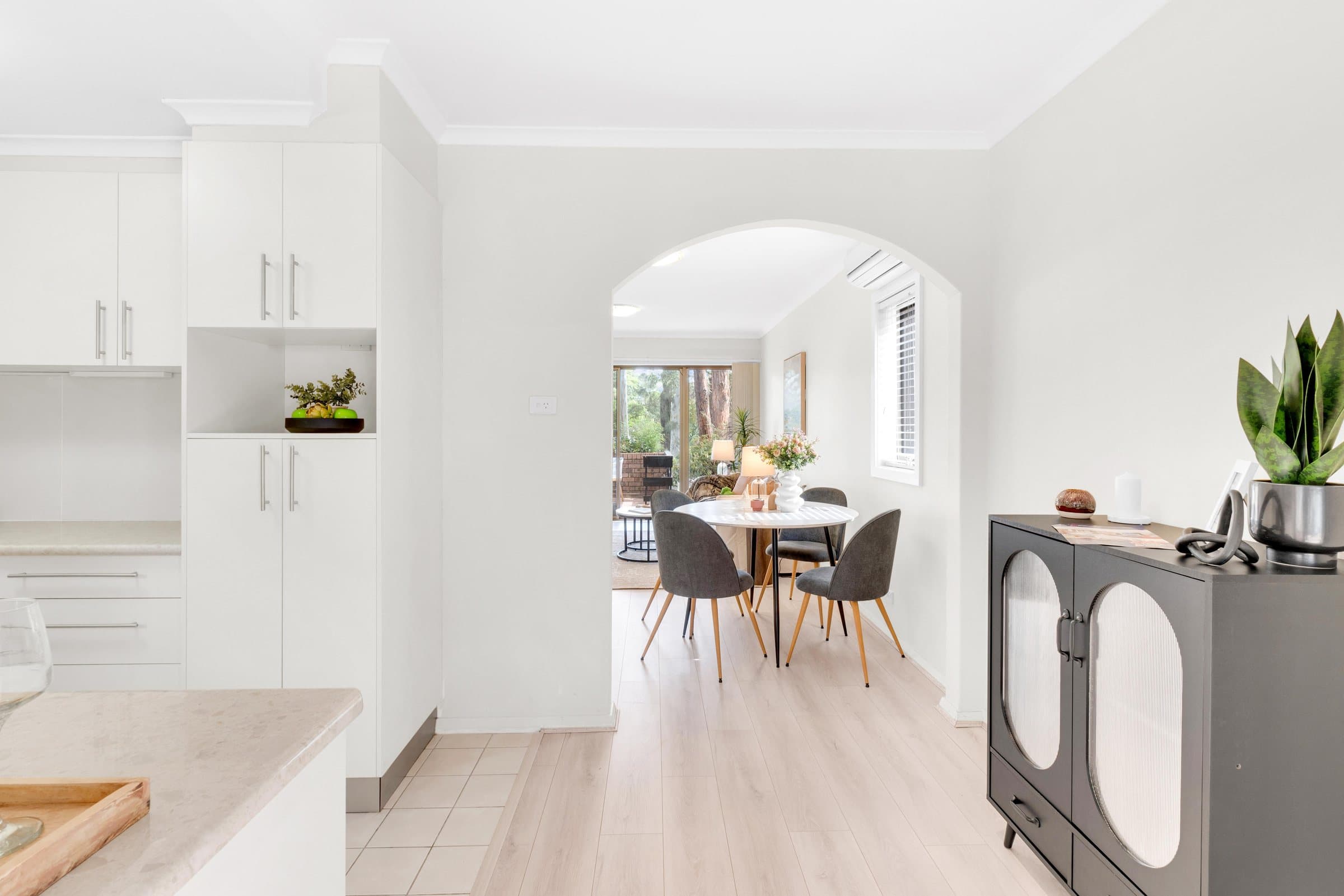 Hallway and dining room photographed to show spatial flow in a Pune home